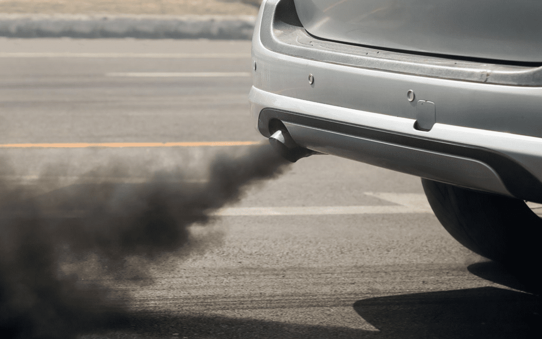 Pollutants emitted from a car exhaust pipe.