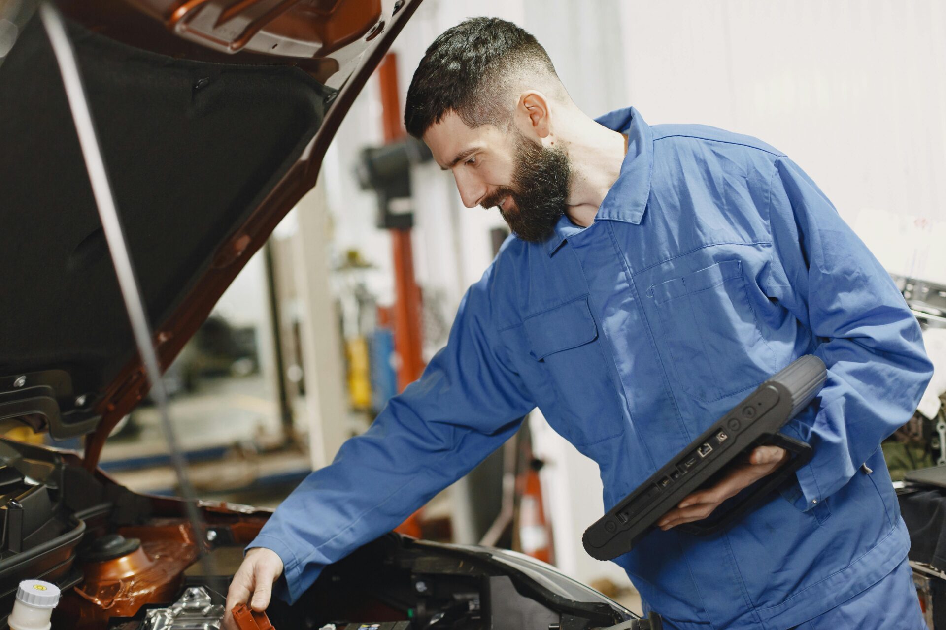 A mechanic checking a car